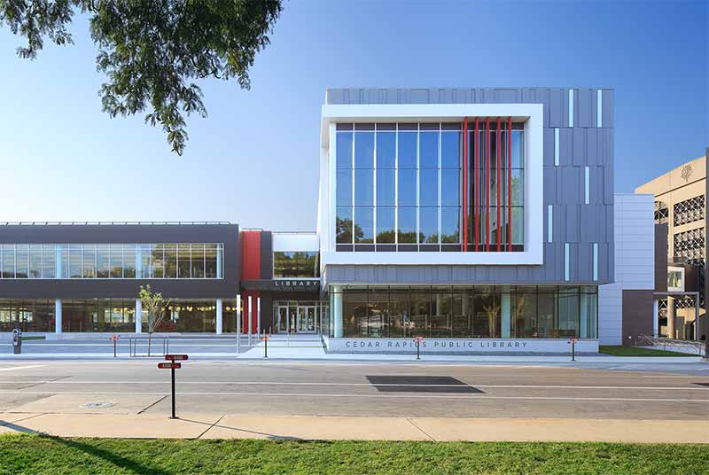 A library at street level with a ramp up to the door